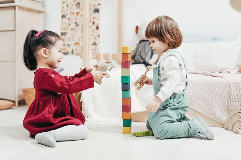 2 children in a preschool classroom setting